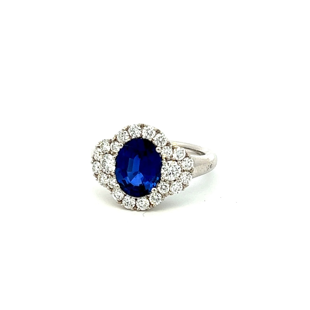 Platinum Ring With An Oval Sapphire Weighing 2.32ct And Round Diamond Halo And Side Stones Weighing 0.98ct