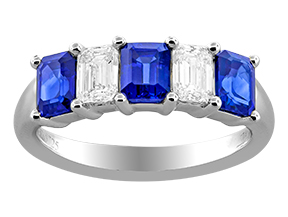 18Kt White Gold Band with (3) Emerald Cut Sapphires Weighing 1.87ct And (2) Emerald Cut Diamonds Weighing 0.62ct