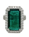 [20858] 18Kt White Gold Halo Style Ring With An Emerald Cut Emerald Weighing 7.49ct And A Halo And Band Of 103 Round Diamonds Weighing 1.25ct