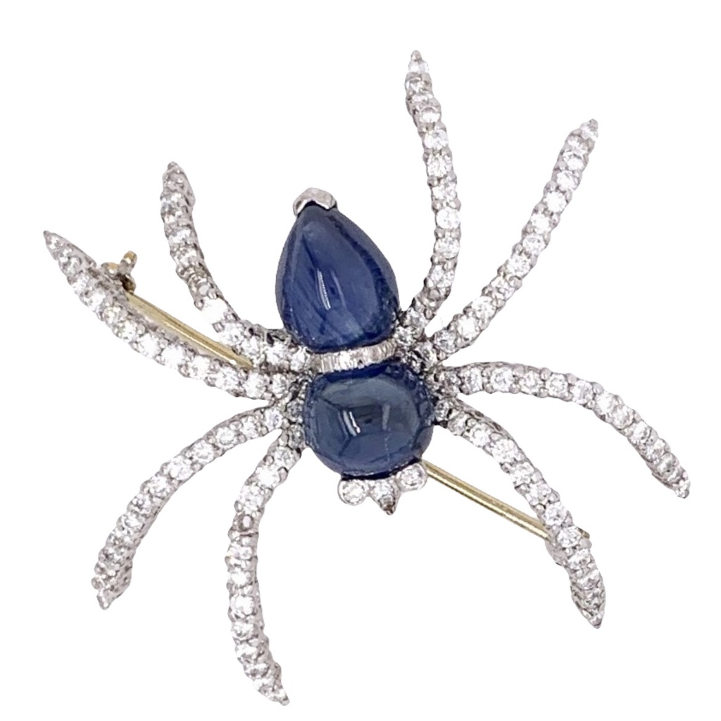18Kt White Gold Spider Pin With (2) Cab Sapphires Weighing 5.70ct And (113) Round Diamonds Weighing 1.13ct