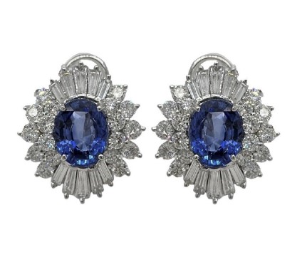 Platinum Halo Style Studs With (2) Oval Sapphires Weighing 6.66ct. (36) Round Diamonds Weighing 3.15ct, And (20) Baguette Diamonds Weighing 2.35ct