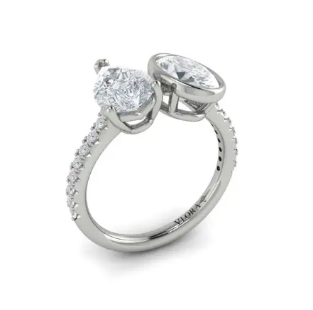 14Kt White Gold Semi Mount Oval And Pear Toi Et Moi Ring With (16) Round Diamonds Weighing 0.21cttw