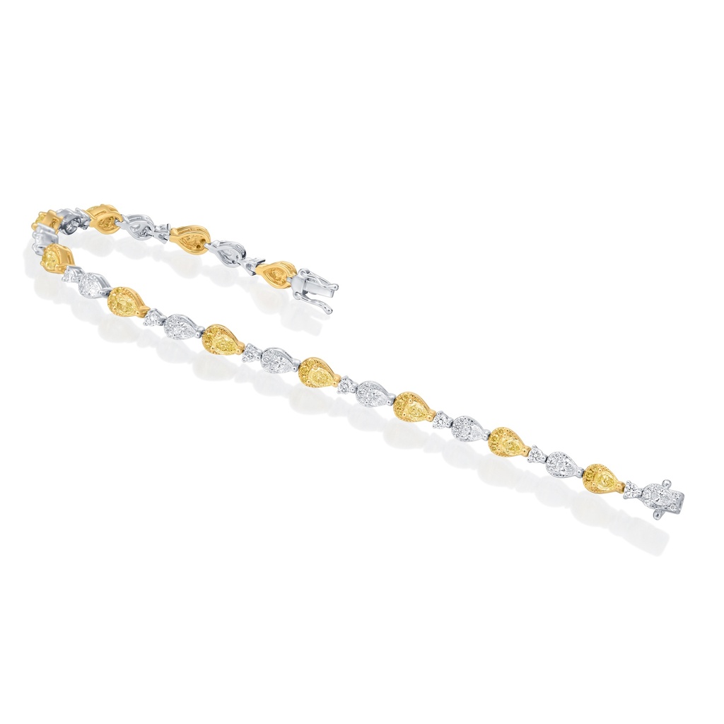 [7942-2] 18Kt Two Toned Bracelet With (47) Round And (11) Pear Shaped White Diamonds Weighing 1.64ct, And (33) Round And (11) Pear Shaped Yellow Diamonds Weighing 2.12ct