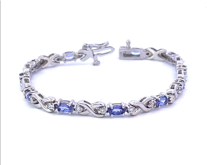 14Kt White Gold Tennis Bracelet With Oval Tanzanites Weighing 3.00ct And Round Diamonds Weighing 0.85ct