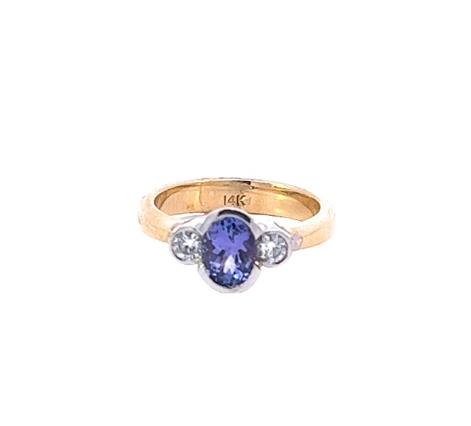 14Kt Two Toned Ring With An Oval Tanzanite Weighing 1.03ct And Round Diamonds Weighing 0.26ct