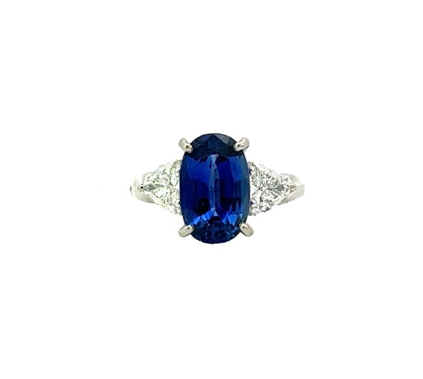 Platinum Ring With An Oval Sapphire Weighing 3.50ct And 2 Trillion Cut Diamonds Weighing 0.82ct E-F/VS