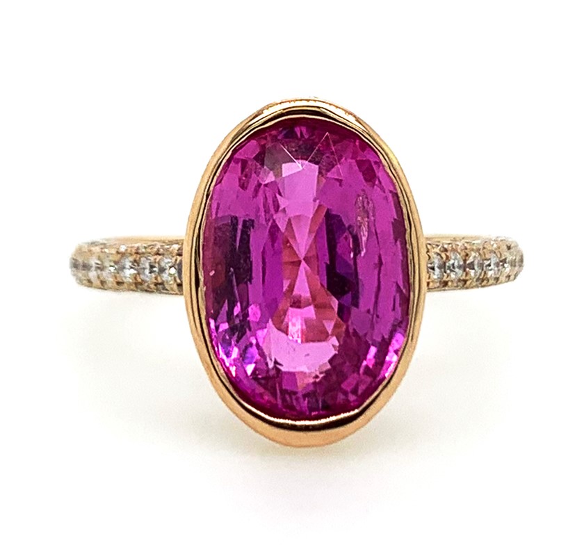 18Kt Rose Gold Ring With A Bezel Set Oval Pink Sapphire Weighing 4.10ct And (138) Round Diamonds Weighing 0.70ct G-H/VS