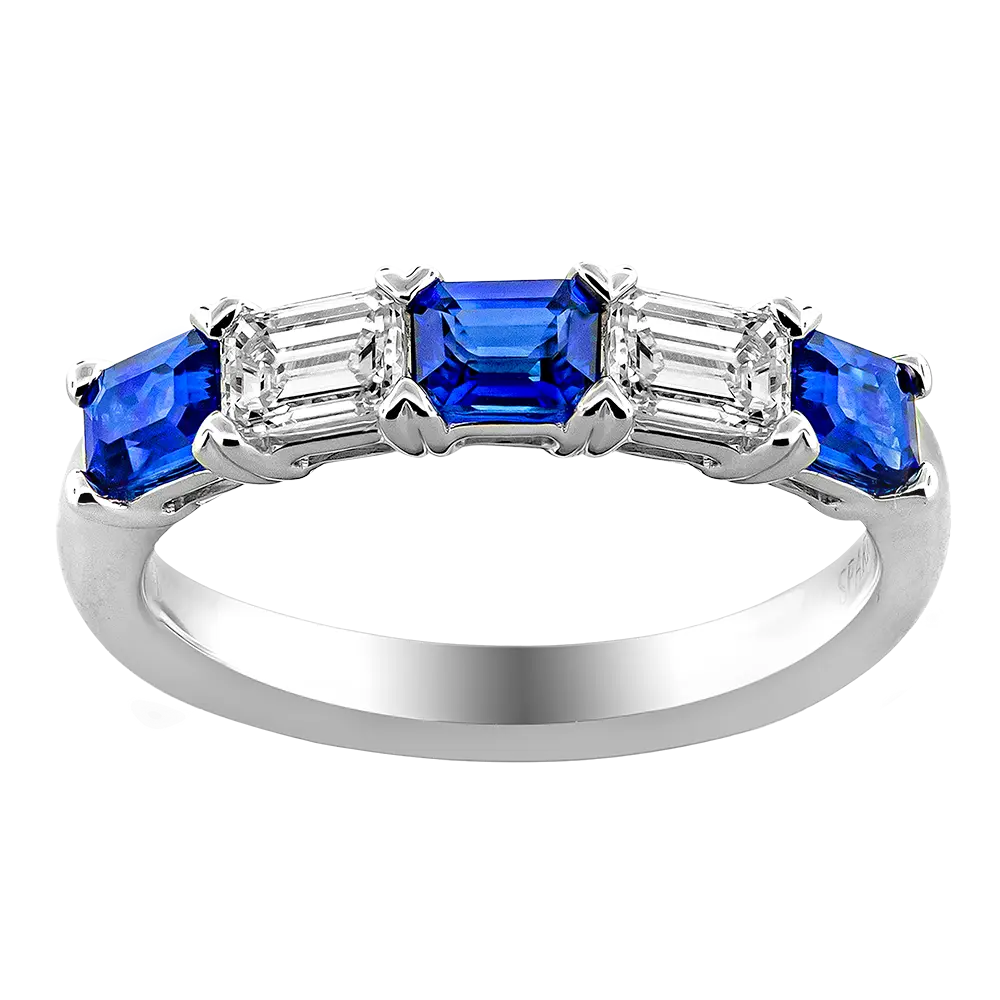 18Kt White Gold Band With (3) Emerald Cut Sapphires Weighing 0.75ct And (2) Emerald Cut Diamonds Weighing 0.46ct