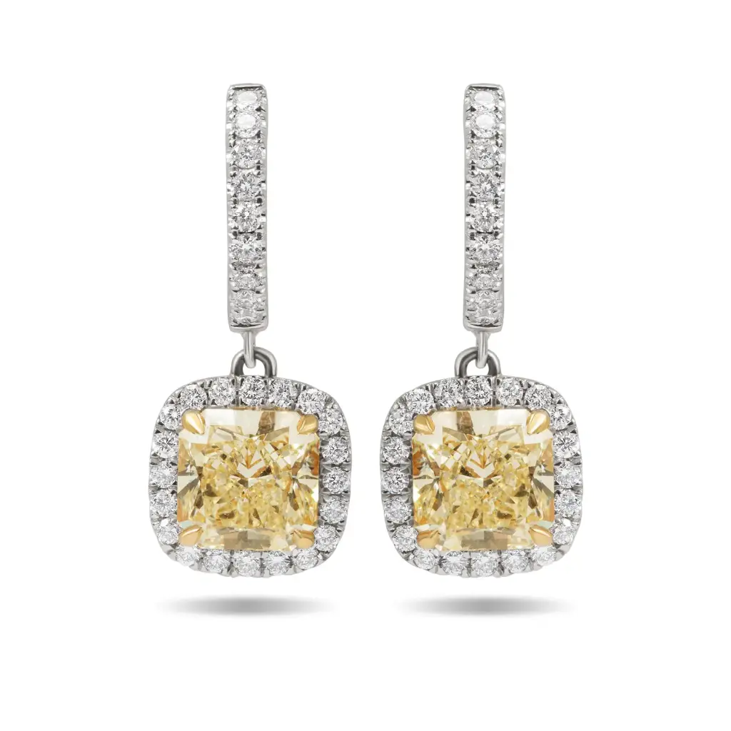Halo Style Dangle Earrings With (2) Radiant Yellow Diamonds Weighing 4.86ct And Round Diamonds Weighing 1.00ct In 18Kt White And Yellow Gold