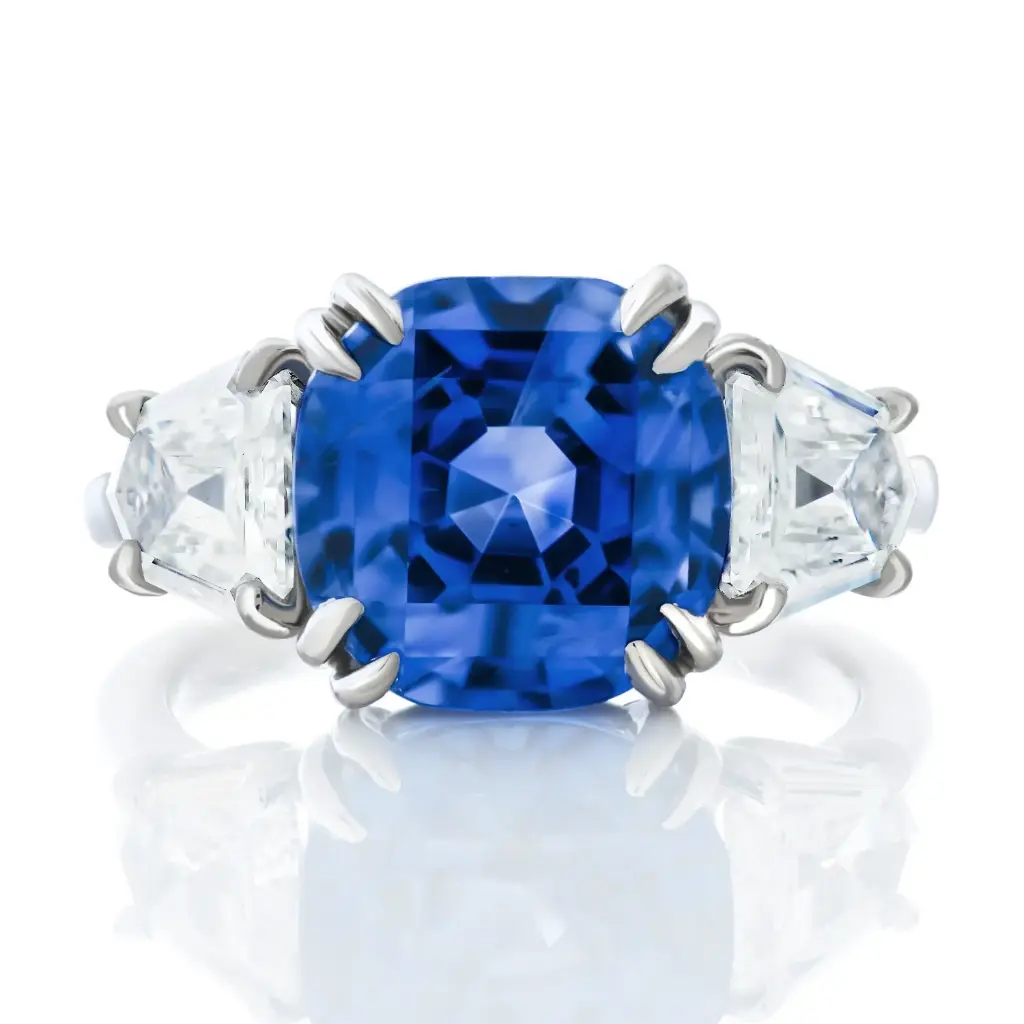 Three Stone Ring With A Mixed Cut Sapphire Weighing 7.15ct And (2) Calf Head Diamonds Weighing 1.32ct In Platinum