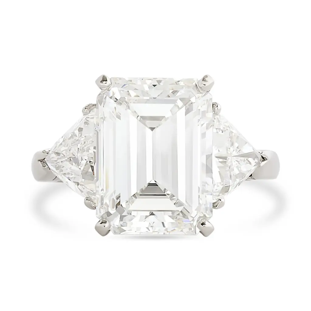 Three Stone Ring With An Emerald Cut Diamond Weighing 6.06ct And (2) Trillion Cut Diamonds Weighing 1.74ct In Platinum