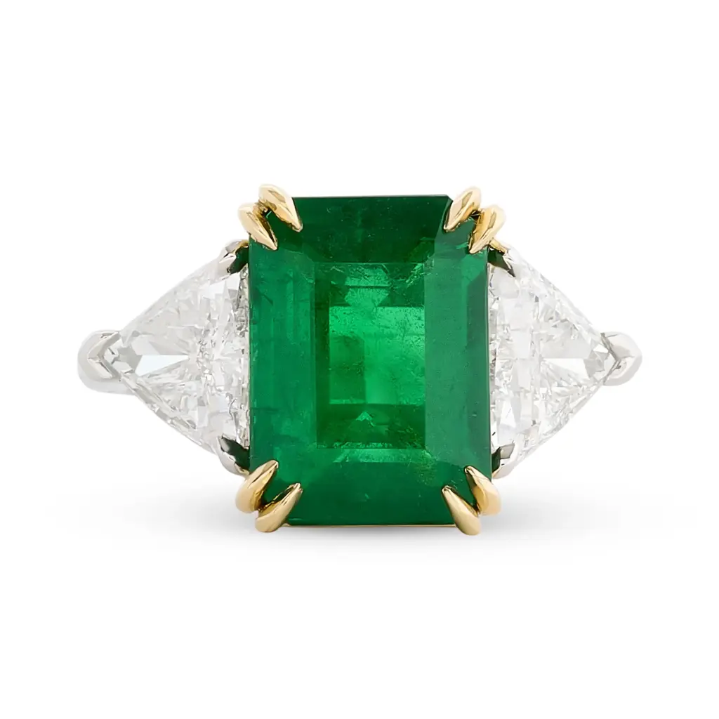 Three Stone Ring With An Emerald Cut Emerald Weighing 4.71ct And (2) Trillion Cut Diamonds Weighing 1.91ct In Platinum And 18Kt Yellow Gold