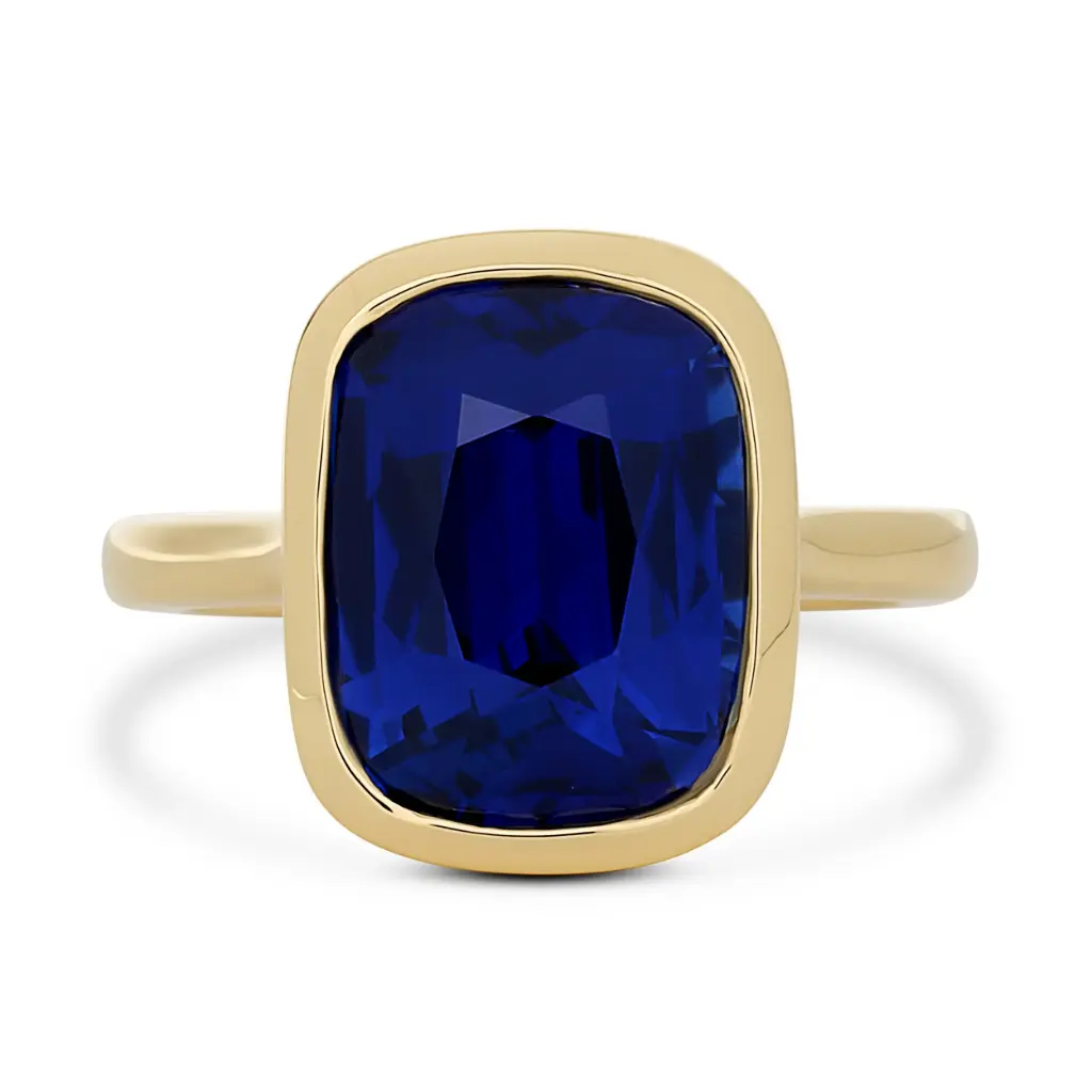 Bezel Set Ring With A Cushion Cut Sapphire Weighing 9.27cttw In 18Kt Yellow Gold