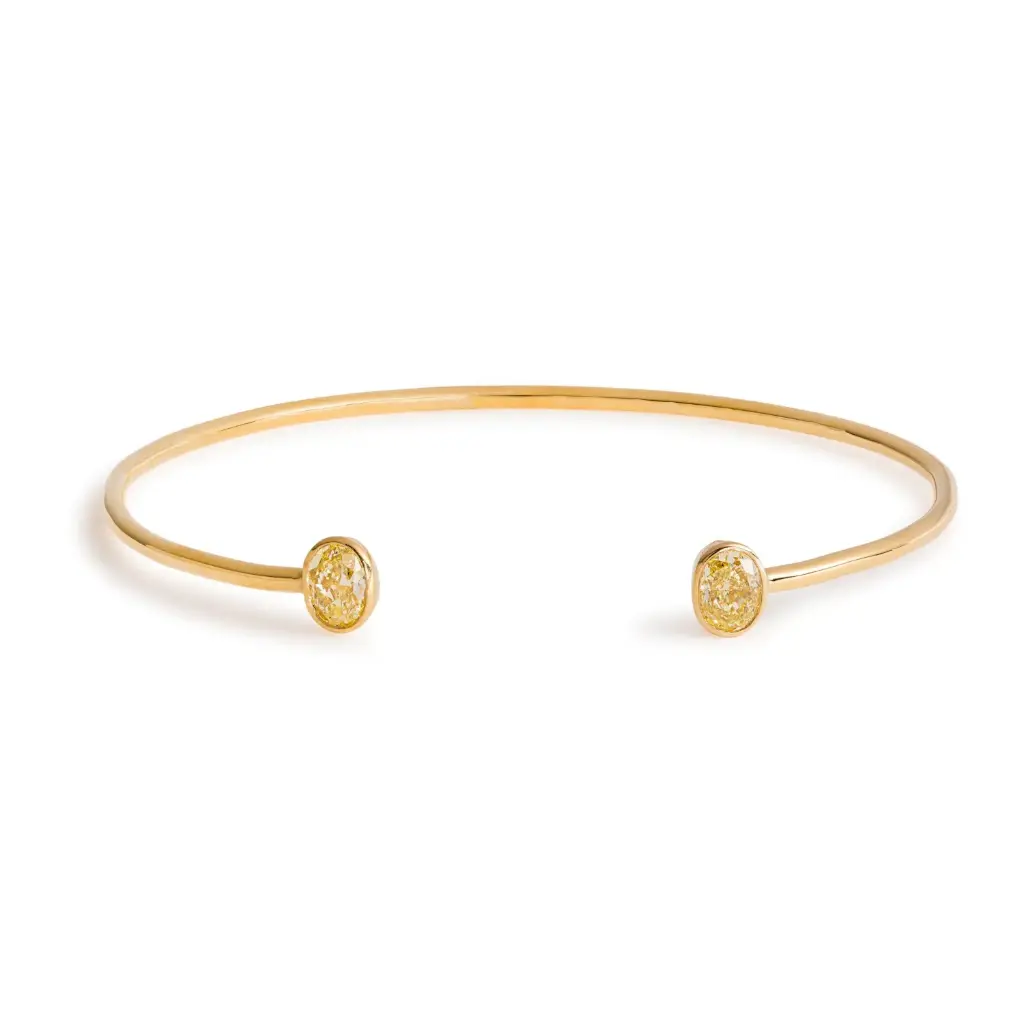 Bezel Set Cuff Bracelet With (2) Oval Yellow Diamonds Weighing 1.12cttw In 18Kt Yellow Gold