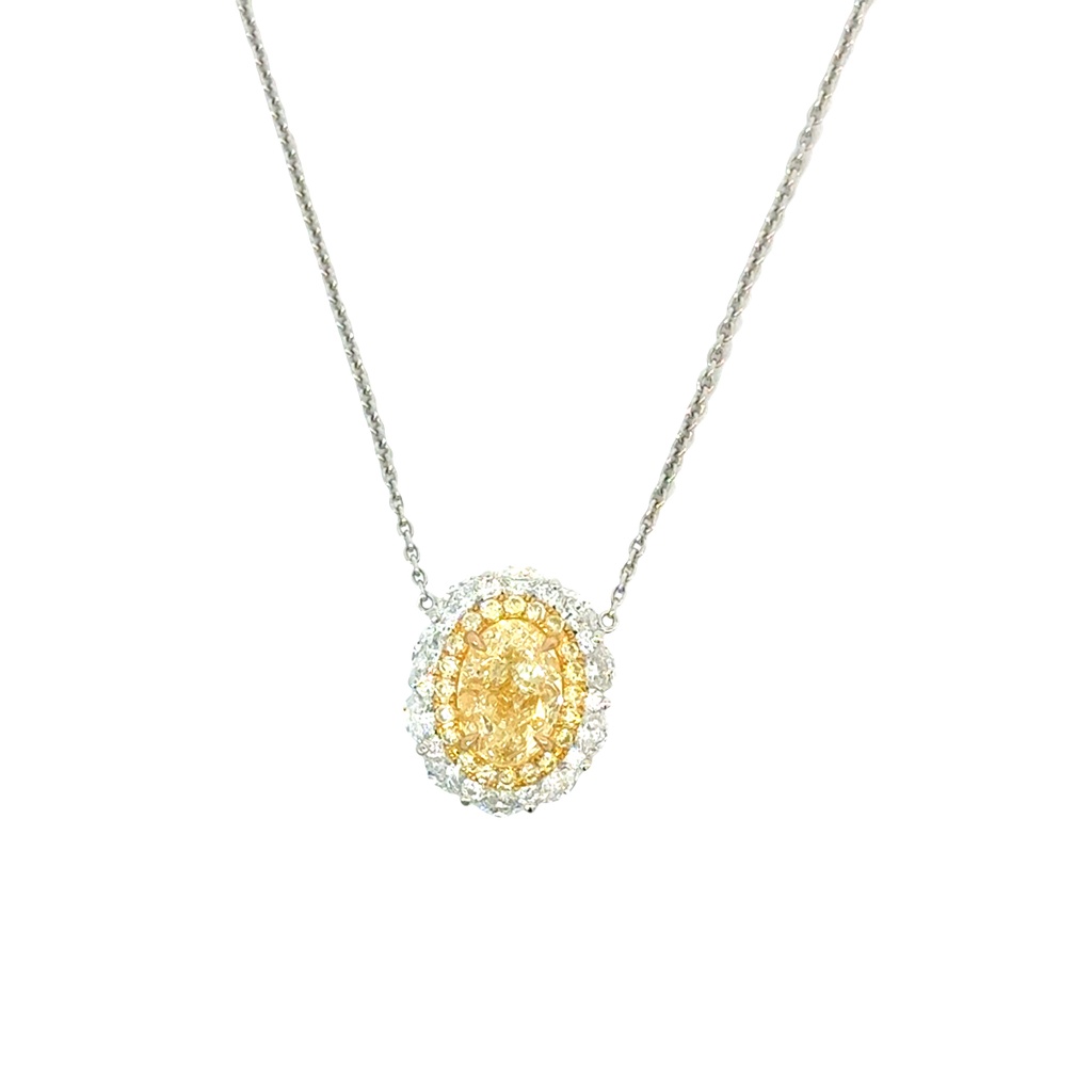 Halo Style Necklace With An Oval Yellow Diamond Weighing 1.31ct, (20) Round Yellow Diamonds Weighing 0.23ct, And (10) Marquise Diamonds Weighing 0.45ct In 18Kt White Gold