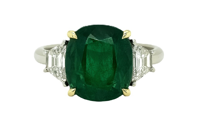 Platinum And 18Kt Yellow Gold Three Stone Ring With A Cushion Cut Emerald Weighing 5.17ct And (2) Trapezoid Diamonds Weighing 0.55ct
