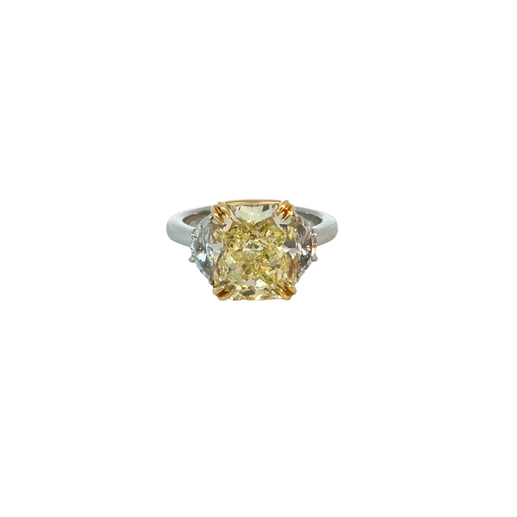 Platinum and 18Kt Yellow Gold Three Stone Ring With A Radiant Yellow Diamond Weighing 5.75ct And (2) Half Moon Diamonds Weighing 0.43ct
