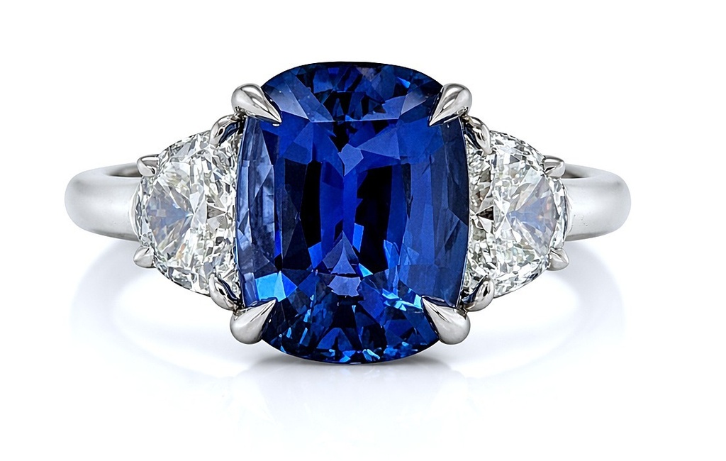 [24591] Platinum Three Stone Ring With A Cushion Cut Sapphire Weighing 6.02ct And (2) Half Moon Diamonds Weighing 1.04ct