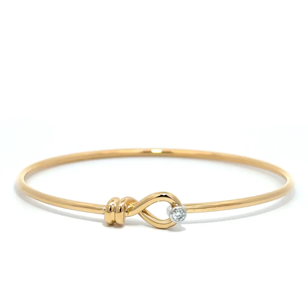 18Kt Two Toned Hook Link Bangle With A Round Diamond Weighing 0.07ct
