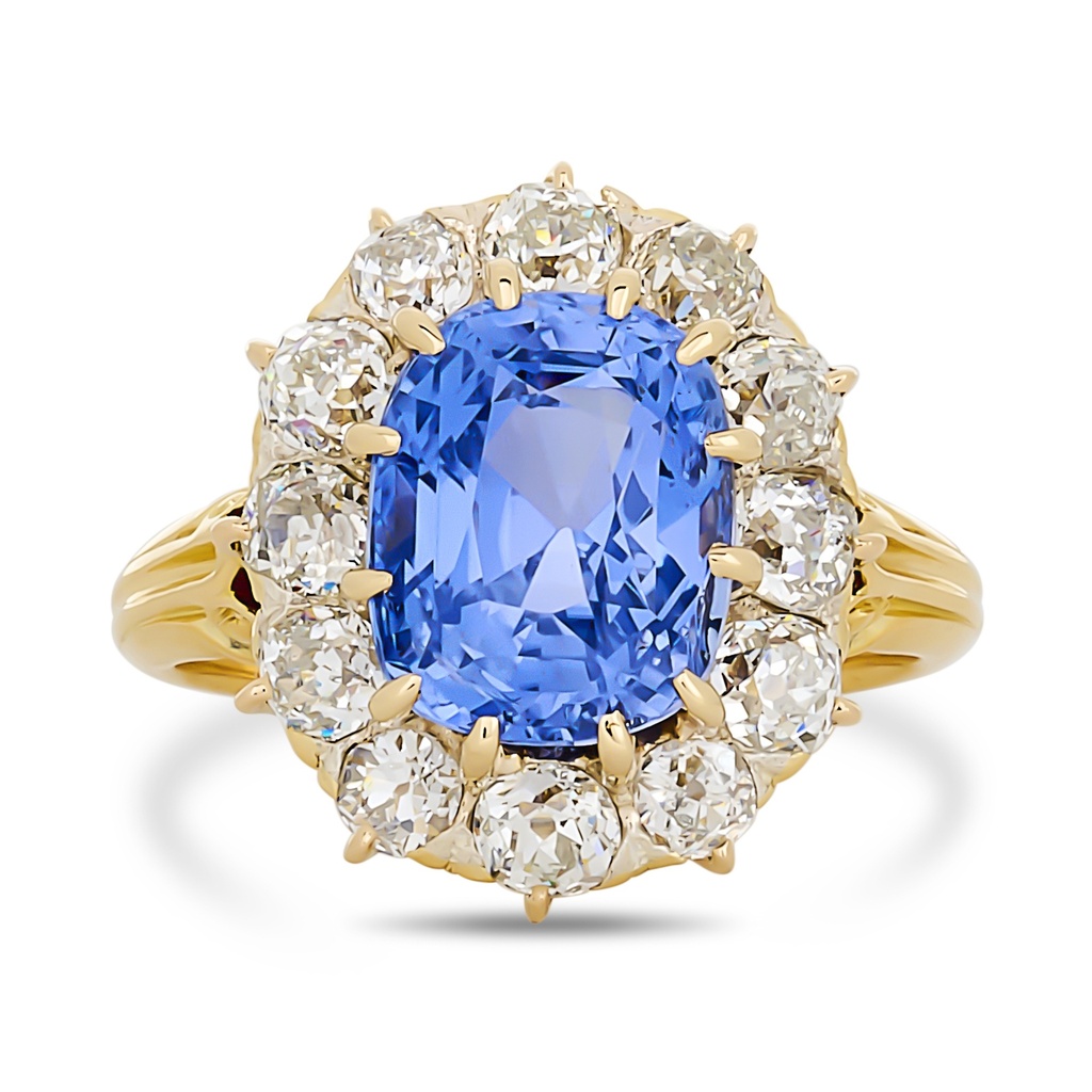 18Kt Yellow Gold Halo Style Ring With A Cushion Cut Sapphire Weighing 5.37ct And (12) Old European Cut Diamonds Weighing 1.50ct