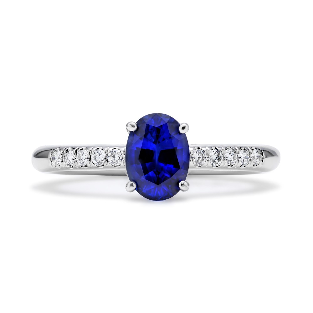 18Kt White Gold Celeste Ring With An Oval Sapphire Weighing 1.15ct And (10) Round Diamonds Weighing 0.13ct