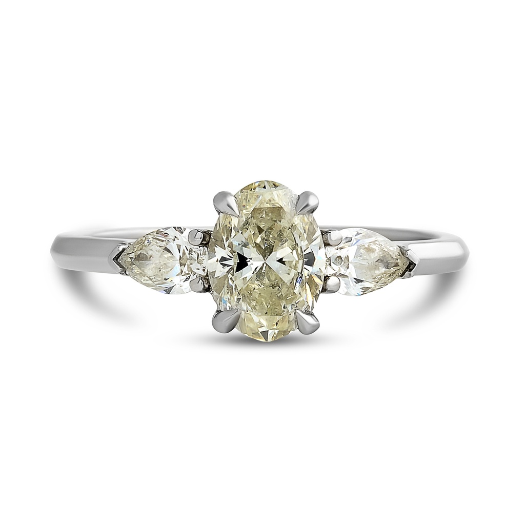 Platinum Three Stone Ring With An Oval Diamond Weighing 0.90ct And (2) Pear Shaped Diamonds Weighing 0.40ct