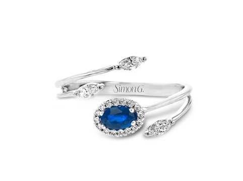 [LR2265] 18Kt White Gold Flare Wrap Ring With An Oval Sapphire Weighing 0.30ct, (16) Round Diamonds Weighing 0.07ct, And (3) Marquise Diamonds Weighing 0.16ct