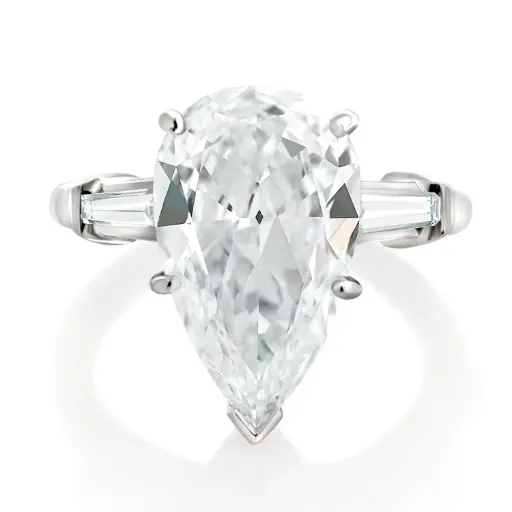 [R70079.2] Three Stone Ring With A Pear Shaped Diamond Weighing 3.29ct And (2) Tapered Baguette Diamonds Weighing 0.34ct