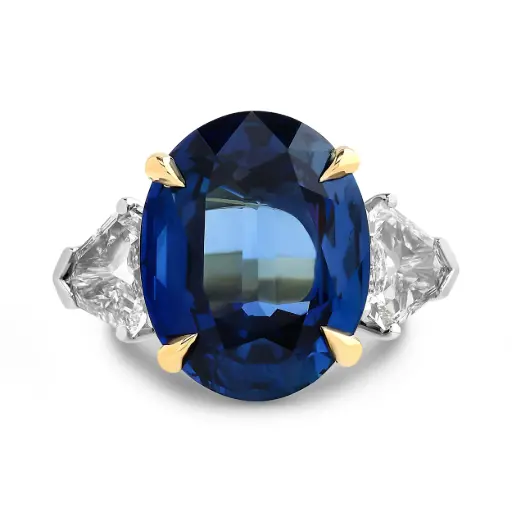 [R80150] Three Stone Ring With An Oval Sapphire Weighing 11.83ct And (2) Sheild Diamonds Weighing 1.57ct In Platinum and 18Kt Yellow Gold