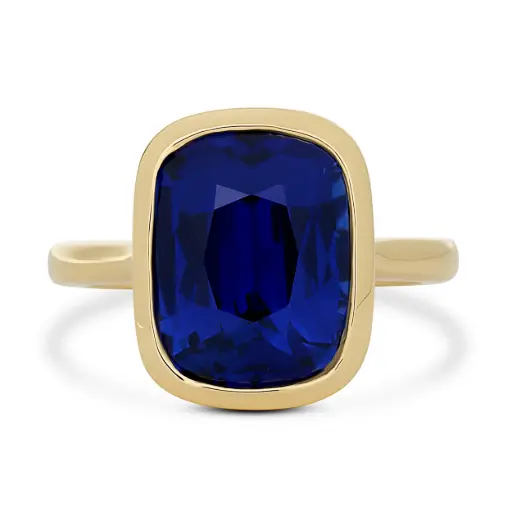 [R81218] Bezel Set Ring With A Cushion Cut Sapphire Weighing 9.27cttw In 18Kt Yellow Gold