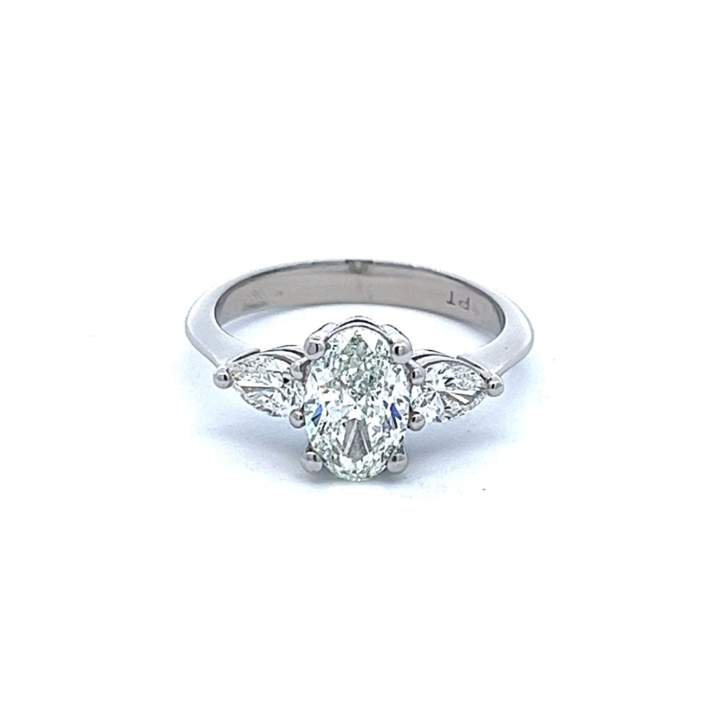 Platinum Three Stone Ring With A Center Oval Diamond Weighing 1.20ct And 2 Pear Shaped Side Stones Weighing 0.43cttw