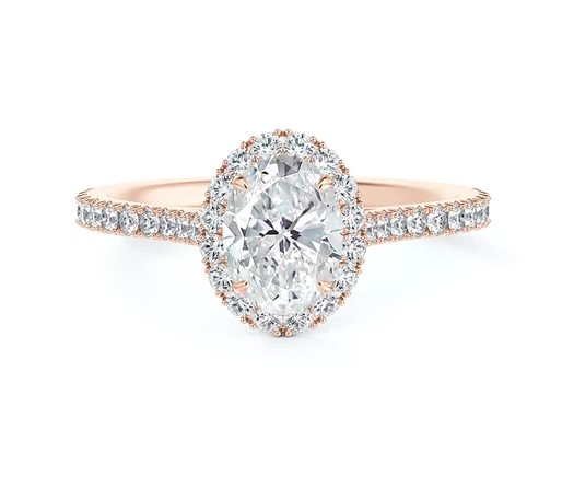 18Kt Rose Gold Halo Style Ring With An Oval Diamond Weighing 0.70ct and (38) Round Diamonds Weighing 0.37ct