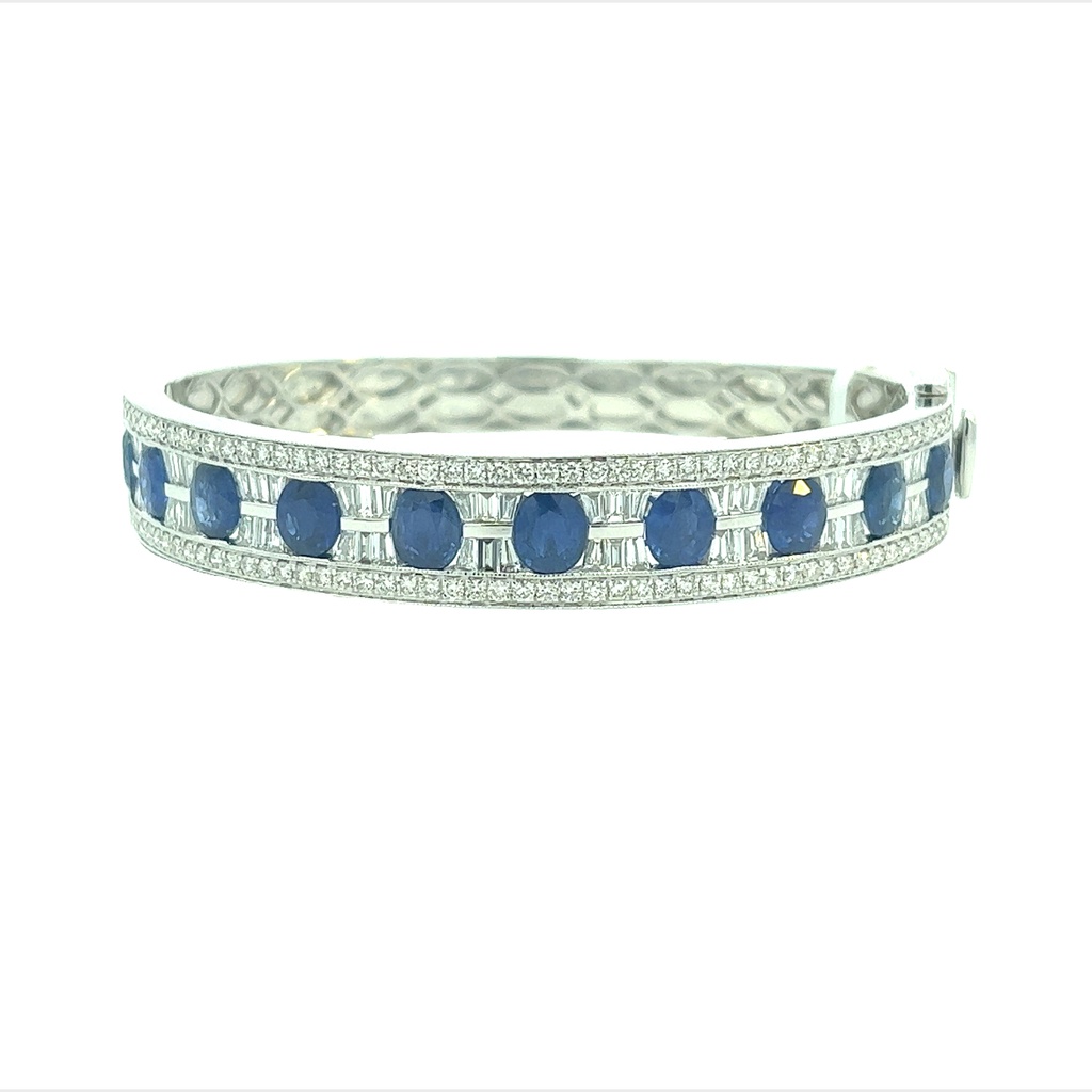 14Kt White Gold Bangle Bracelet With 10 Oval Sapphires Weighing 8.08ct 54 Baguette Diamonds Weighing 1.76ct And 104 Round Diamonds Weighing 1.60ct G-H/SI