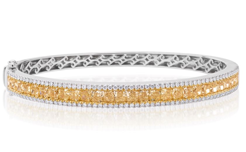 14Kt Two Toned Bangle With (27) Fancy Yellow Cushion Cut Diamonds Weighing 4.73ct And (122) Round Diamonds Weighing 0.82cttw
