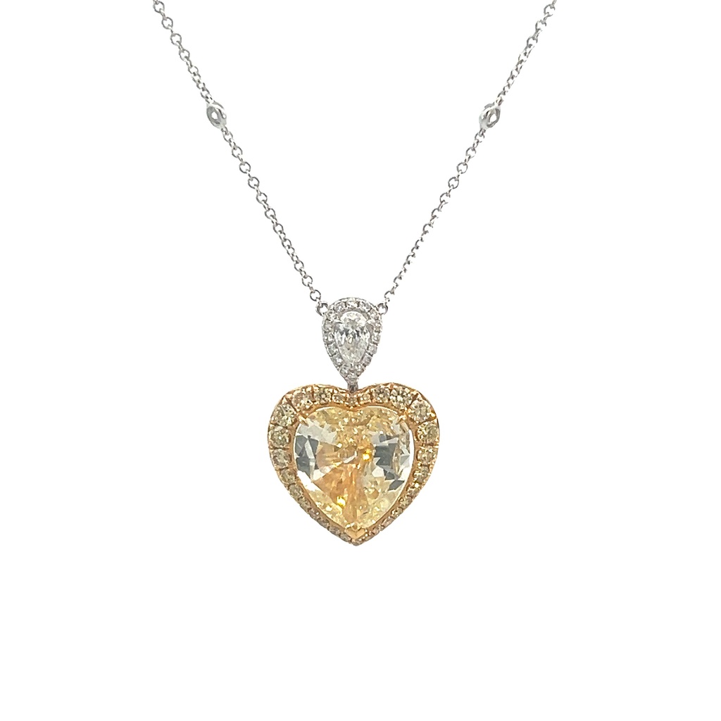 18Kt Two Toned Necklace With A Heart Shaped Yellow Diamond Weighing 3.73ct, A Pear Shaped Diamond Weighing 0.22ct, (28) Round Yellow Diamonds Weighing 0.55ct, And (22) Round White Diamonds Weighing 0.28ct