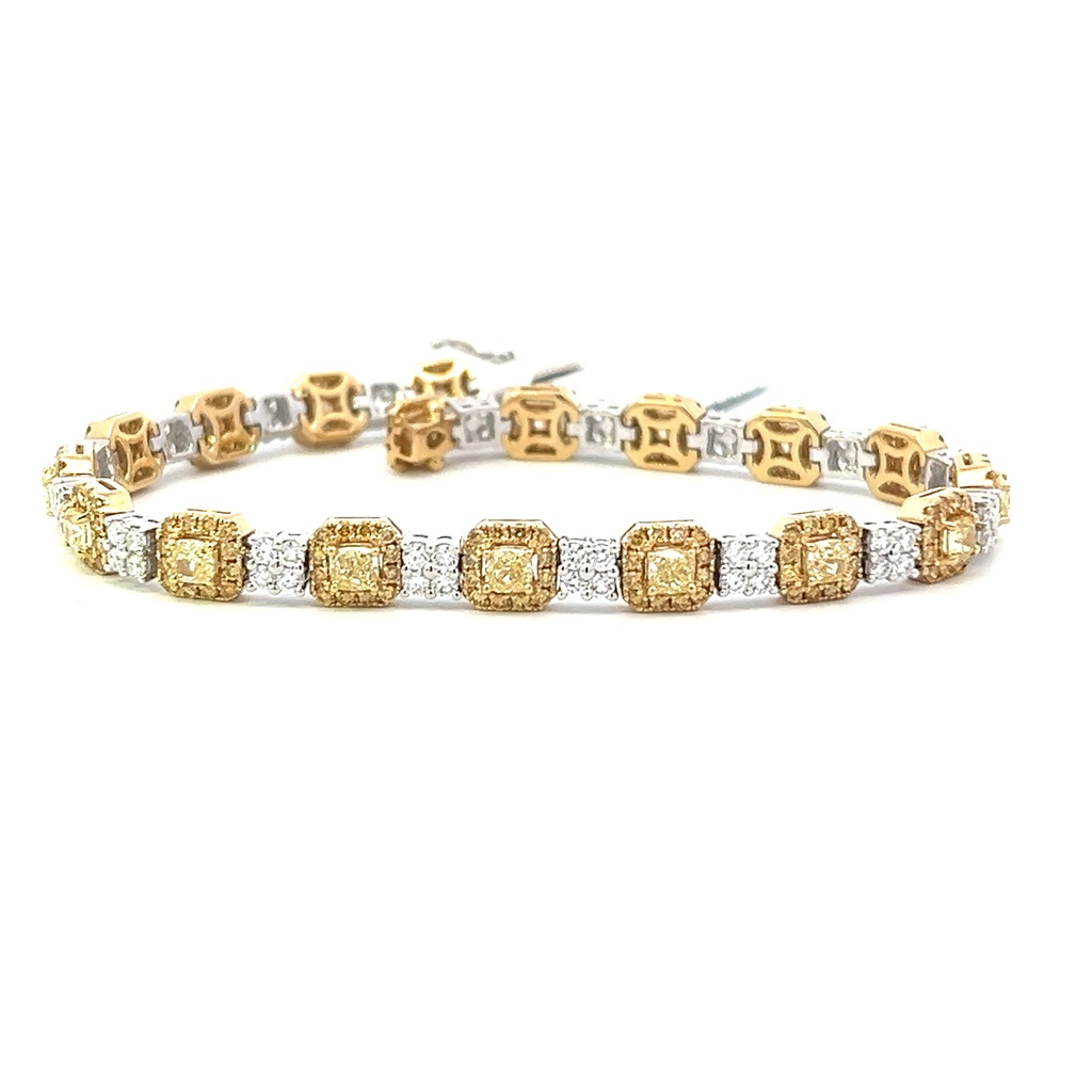 18Kt Two Toned Bracelet With (18) Cushion Cut Yellow Diamonds Weighing 2.86ct, (216) Round Yellow Diamonds Weighing 1.67ct, And (72) Round White Diamonds Weighing 1.53ct