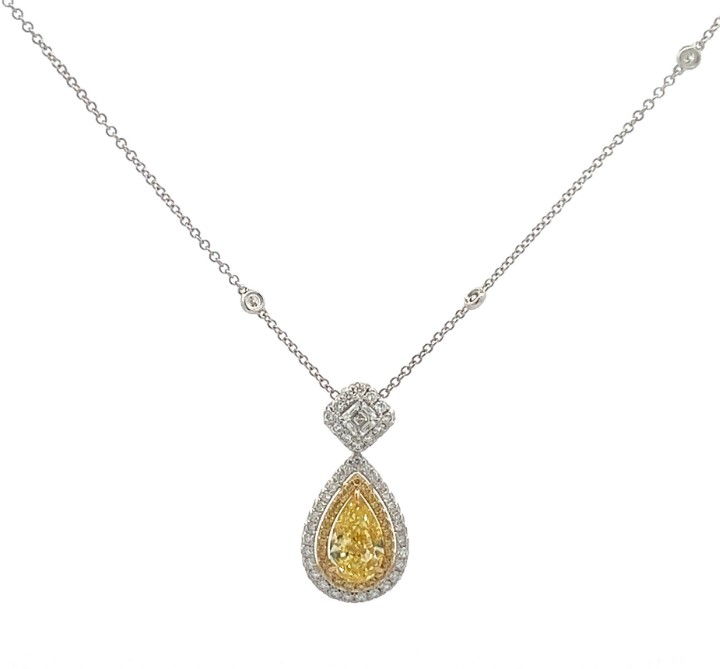 18Kt Two Toned Neck With A Fancy Light Yellow Pear Shaped Diamond Weighing 1.00ct, A Radiant Diamond Weighing 0.21ct, And Yellow And White Round Diamonds Weighing 0.65ct
