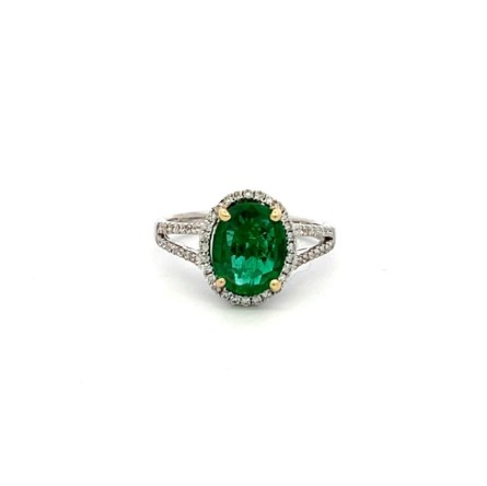 18Kt Two Toned Halo Style Ring With An Oval Emerald Weighing 1.61ct And (60) Round Diamonds Weighing 0.41ct