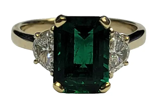 18Kt Yellow Gold Three Stone Ring With an Emerald Cut Emerald Weighing 2.63ct And (2) Half Moon Diamonds Weighing 0.71ct