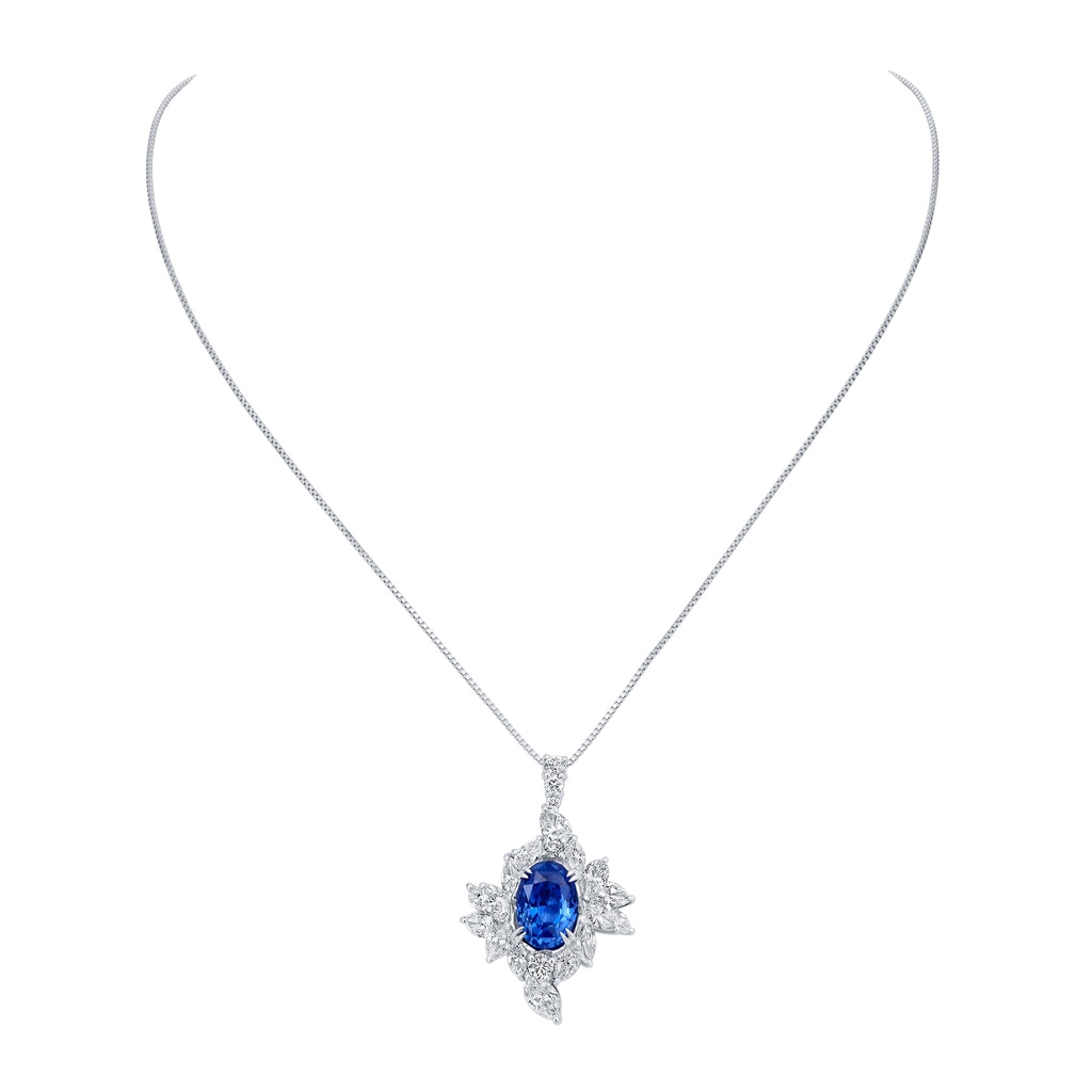Platinum Necklace With An Oval Sapphire Weighing 5.40ct, (4) Pear Shaped Diamonds, (12) Marquise Diamonds, And (5) Round Diamonds Weighing 3.65ct