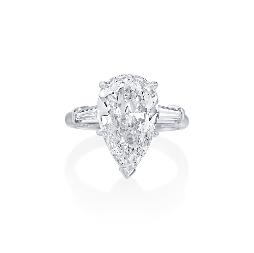 Three Stone Ring With A Pear Shaped Diamond Weighing 3.29ct And (2) Tapered Baguette Diamonds Weighing 0.34ct