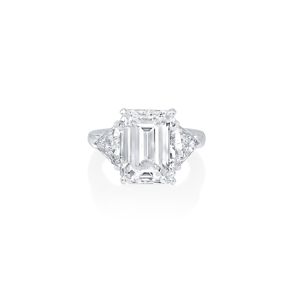 Three Stone Ring With An Emerald Cut Diamond Weighing 6.06ct And (2) Trillion Cut Diamonds Weighing 1.74ct In Platinum