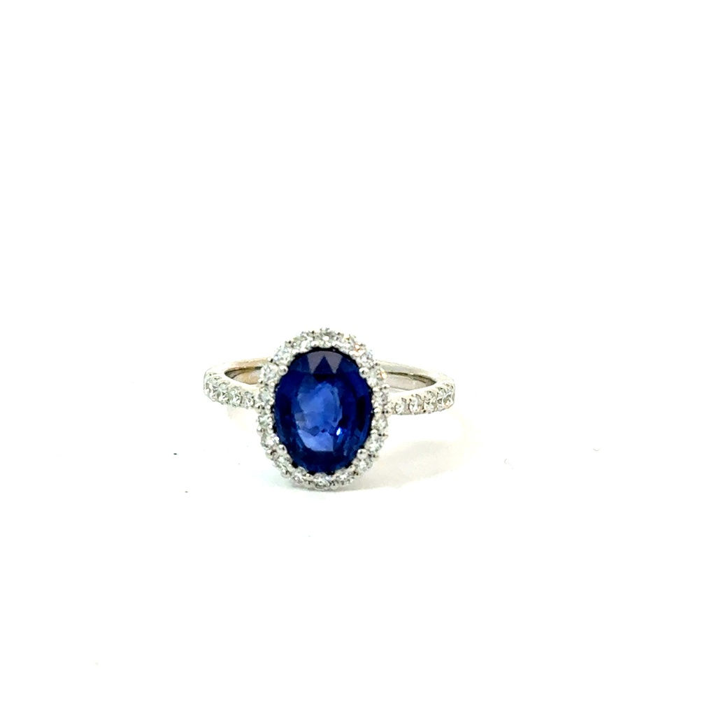 Halo Style Ring With An Oval Sapphire Weighing 2.53ct And (30) Round Diamonds Weighing 0.54ct In 18Kt White Gold
