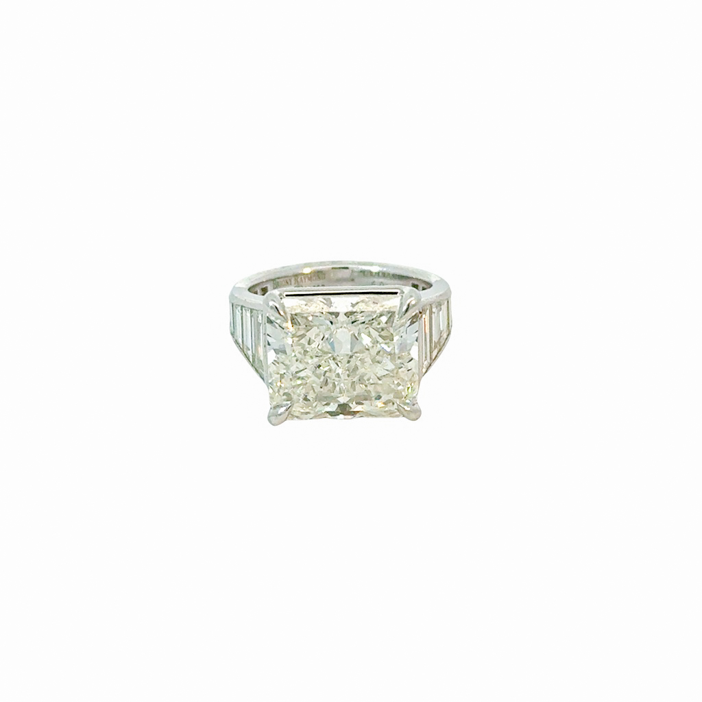 Platinum Ring With A Radiant Cut Diamond Weighing 9.36ct And (16) Trapezoid Diamonds Weighing 2.25ct