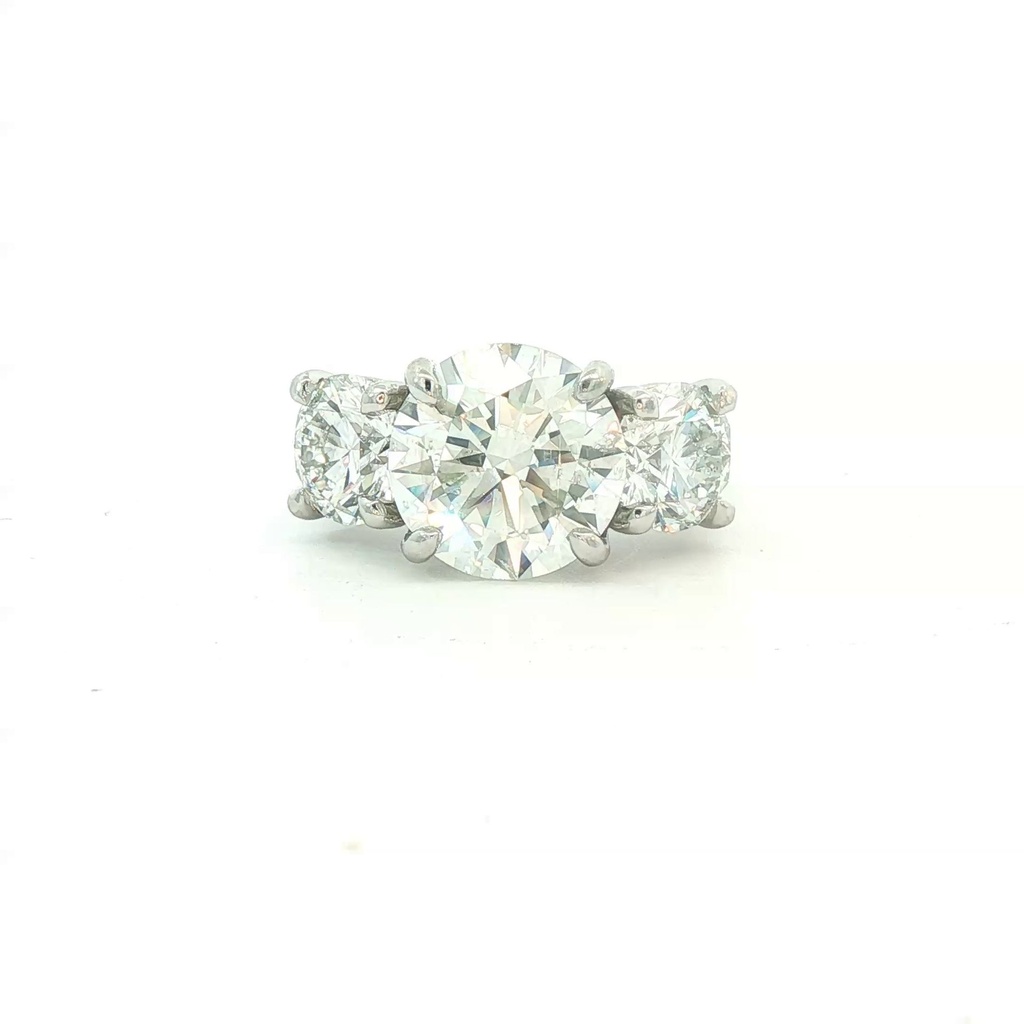 Platinum Three Stone Ring With A Round Diamond Weighing 5.05ct And (2) Round Diamonds Weighing 3.00ct