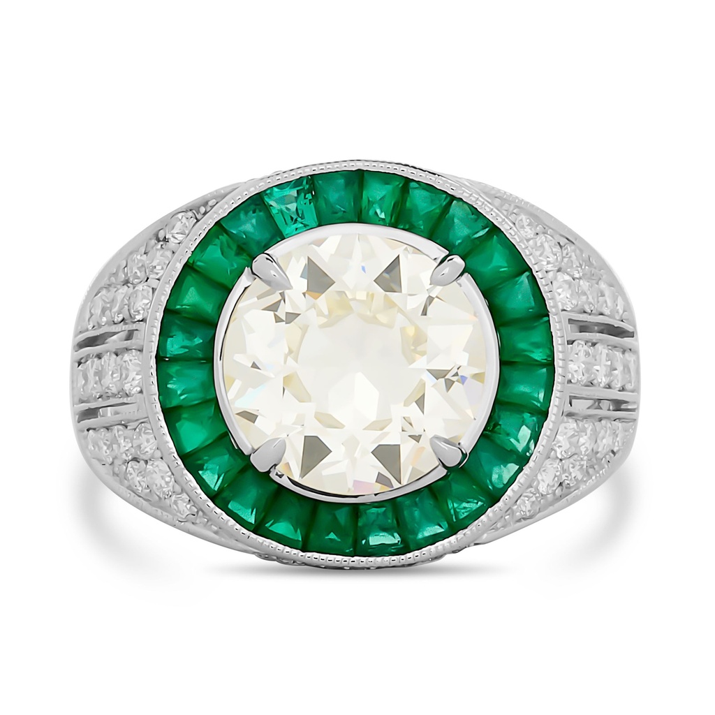 Platinum Ring With A Circular Brilliant Cut Diamond Weighing 2.90ct, Round Diamonds Weighing 0.54ct, And French Cut Emeralds Weighing 1.02ct