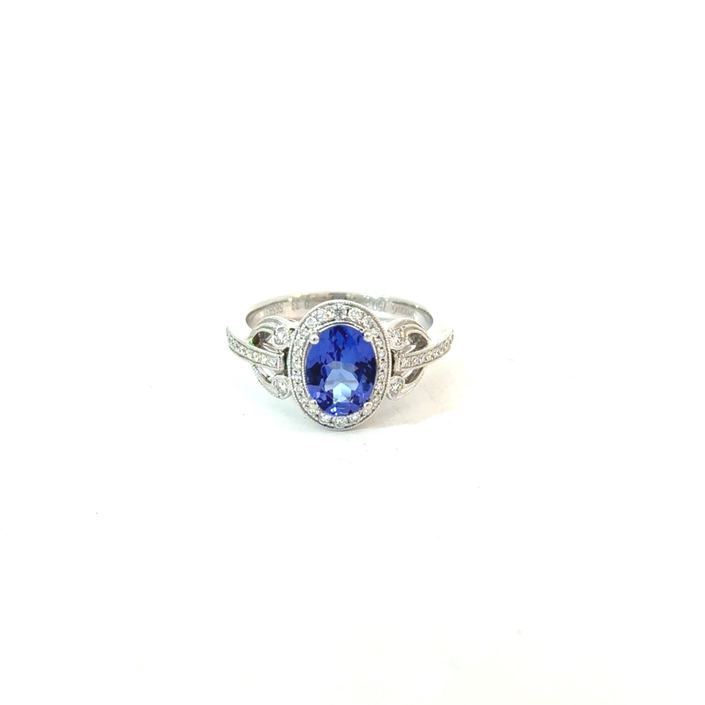 [TR651] 18Kt White Gold Diamond Vintage Halo Semi Mount Ring With An Oval Tanzanite Weighing 1.30ct And Round Diamonds Weighing 0.31ct