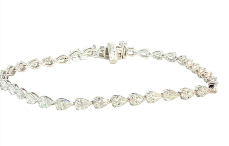 14Kt White Gold Tennis Bracelet With (36) Pear Shaped Diamonds Weighing 5.15cttw