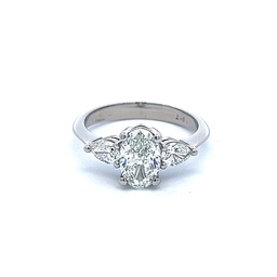 [S01555] Platinum Three Stone Ring With A Center Oval Diamond Weighing 1.20ct And 2 Pear Shaped Side Stones Weighing 0.43cttw