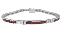 [13962] 18Kt White Gold Tennis Bracelet With (56) French Cut Rubies Weighing 3.78ct And (28) Round Diamonds Weighing 0.53ct